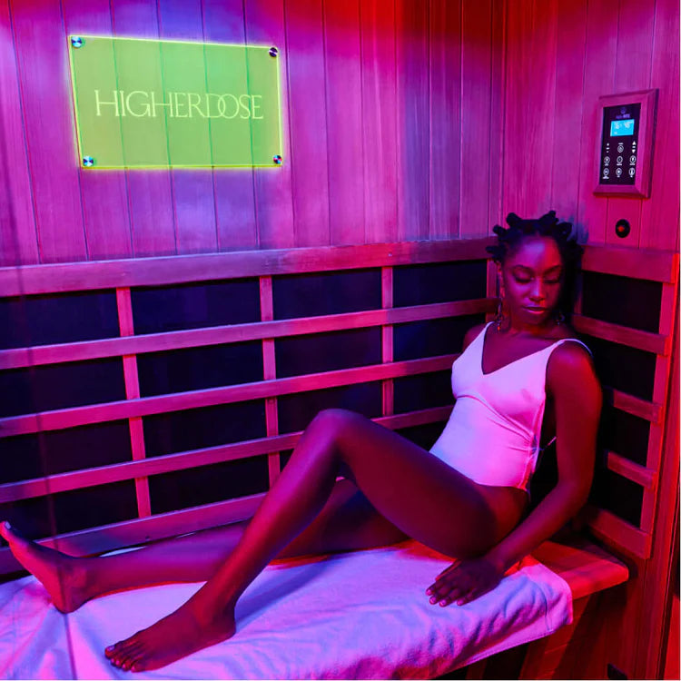 Woman relaxing in a HigherDOSE Full Spectrum Infrared Sauna