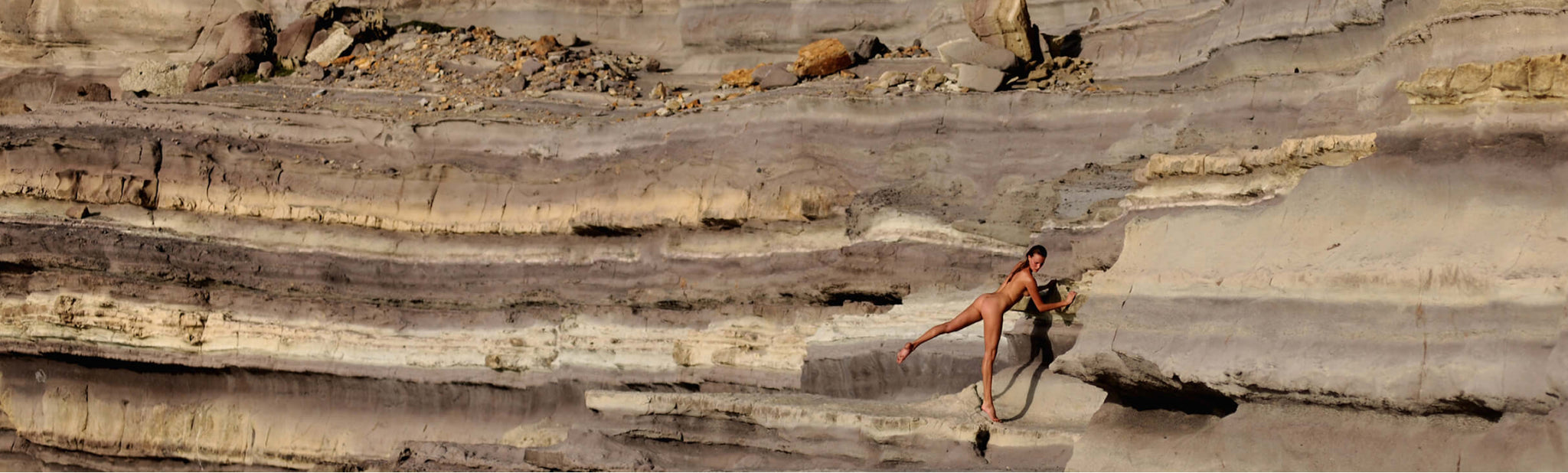 woman standing on rocks
