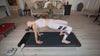 woman doing backbend on mat