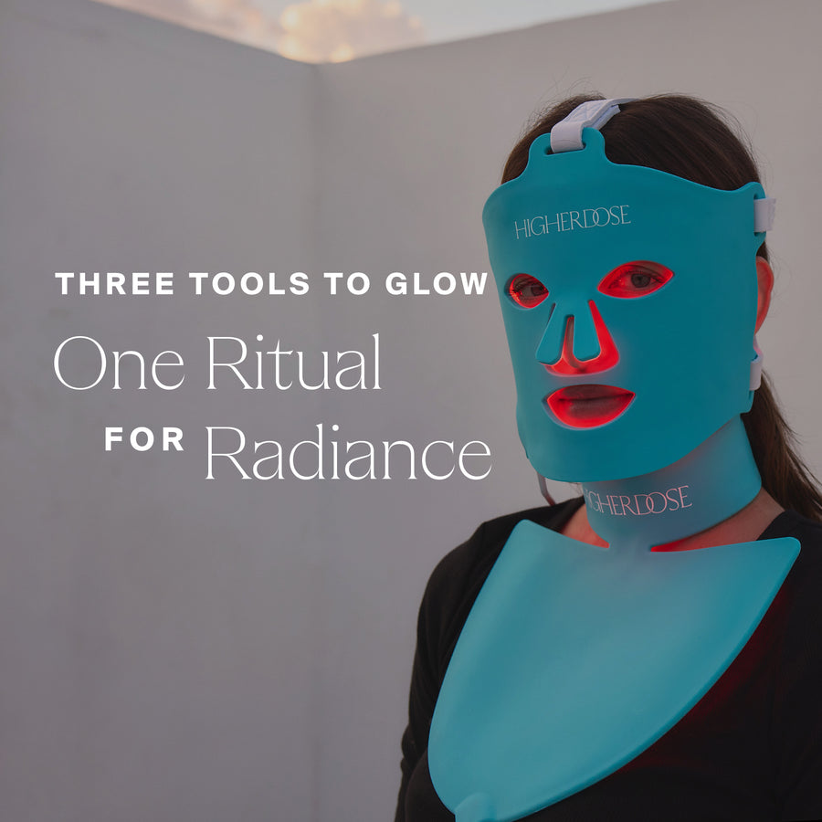 Teal silicone face mask with red light therapy windows and matching neck panel worn by person with dark hair.