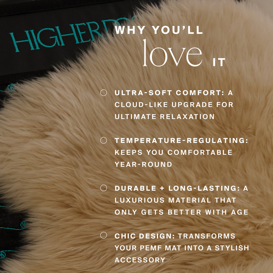 Cream-colored natural sheep shearling cover with soft, fluffy texture and teal accent stitching visible on edges.