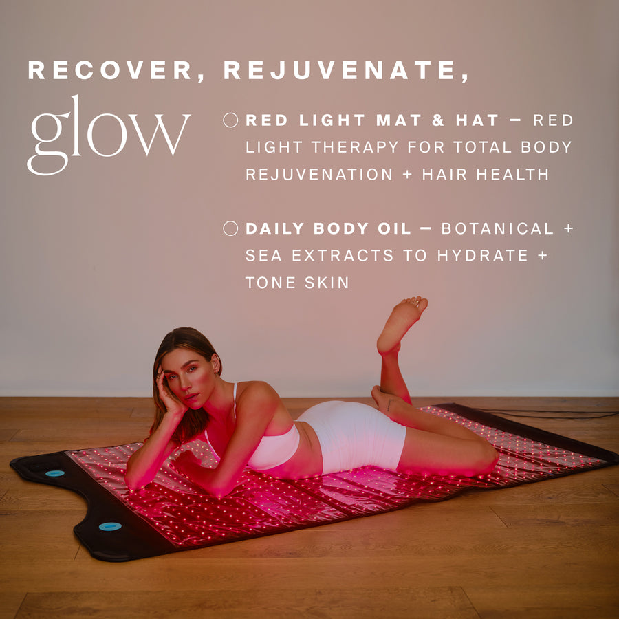 Woman lying on red light therapy mat with matching hat, demonstrating wellness product ritual set.