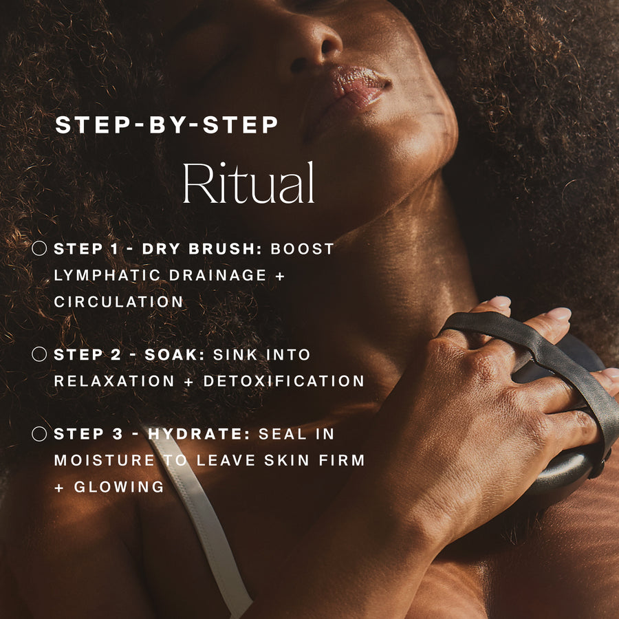 Woman holding black dry brush on shoulder with three-step skincare ritual text displayed.
