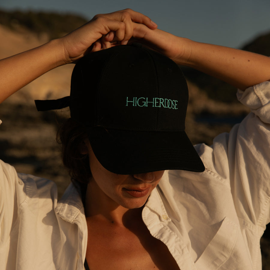 Person wearing black cap with 