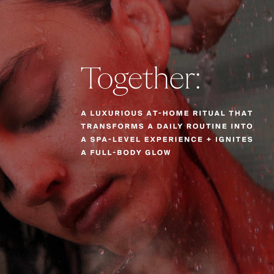 Person's face and shoulders bathed in red light with water droplets during shower.