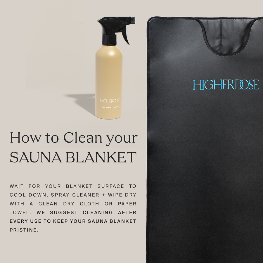 Cream-colored spray bottle with black trigger next to black sauna blanket with blue 