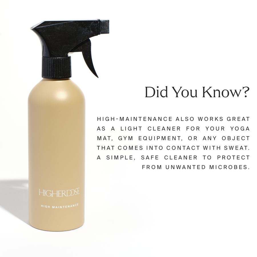 Cream-colored spray bottle with black trigger nozzle labeled 