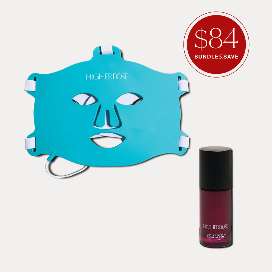 Turquoise face mask with white eye and mouth cutouts alongside a burgundy serum bottle with black cap.
