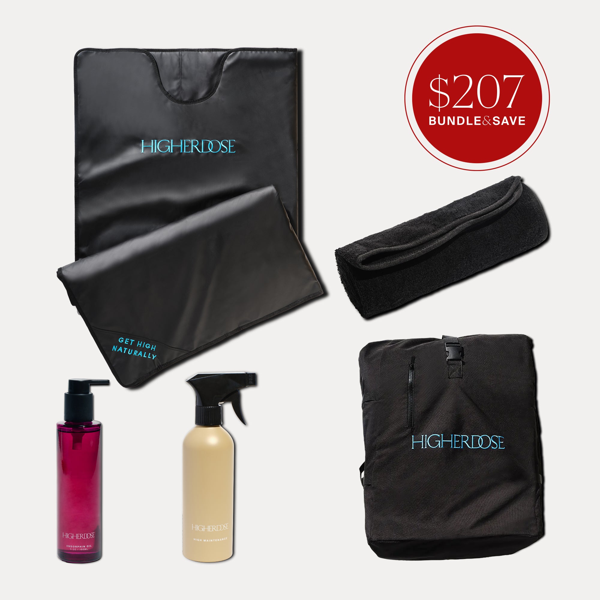 Black sauna blanket with accessories including headband, two bottles, and carrying bag.