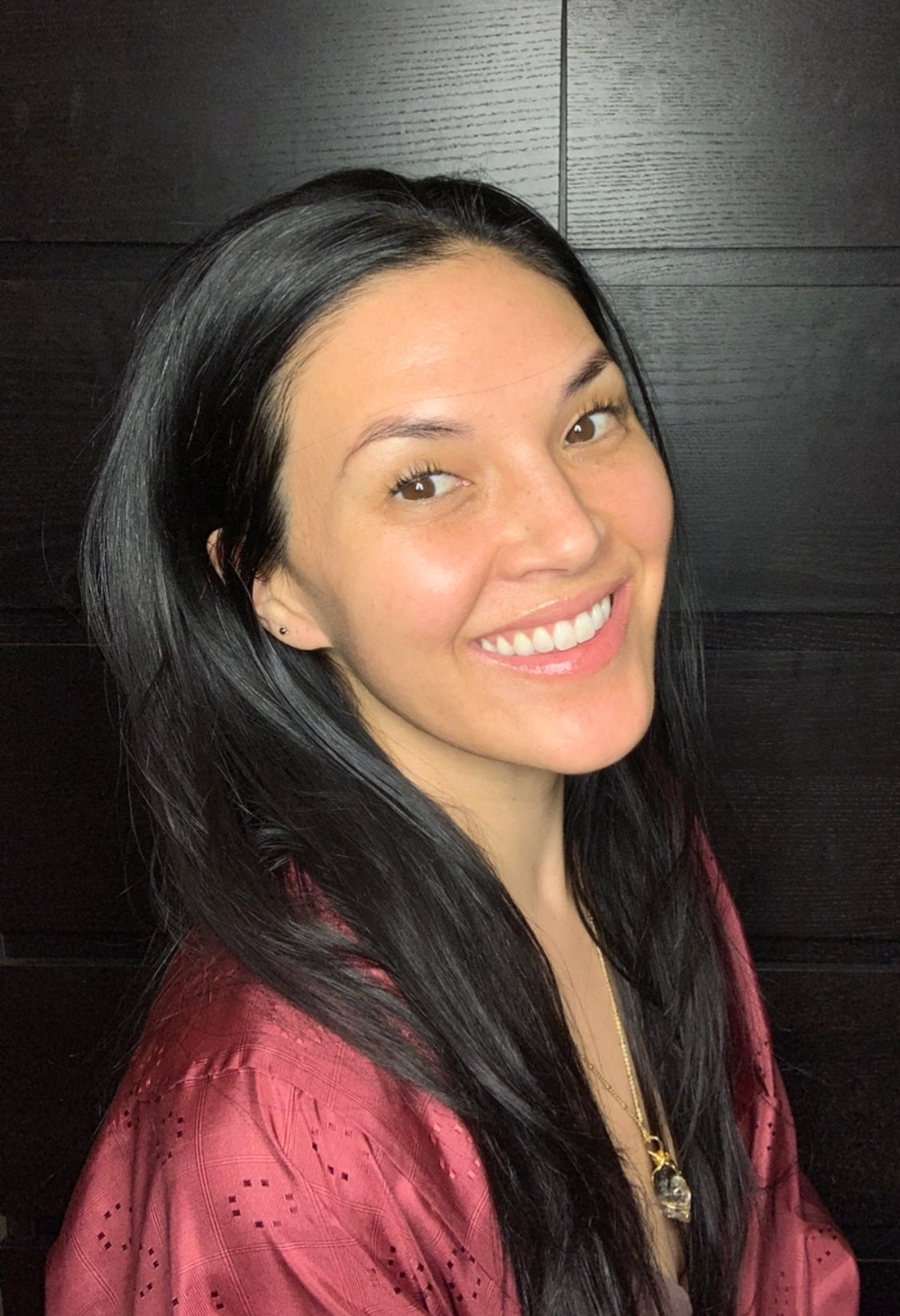Woman with dark hair smiling