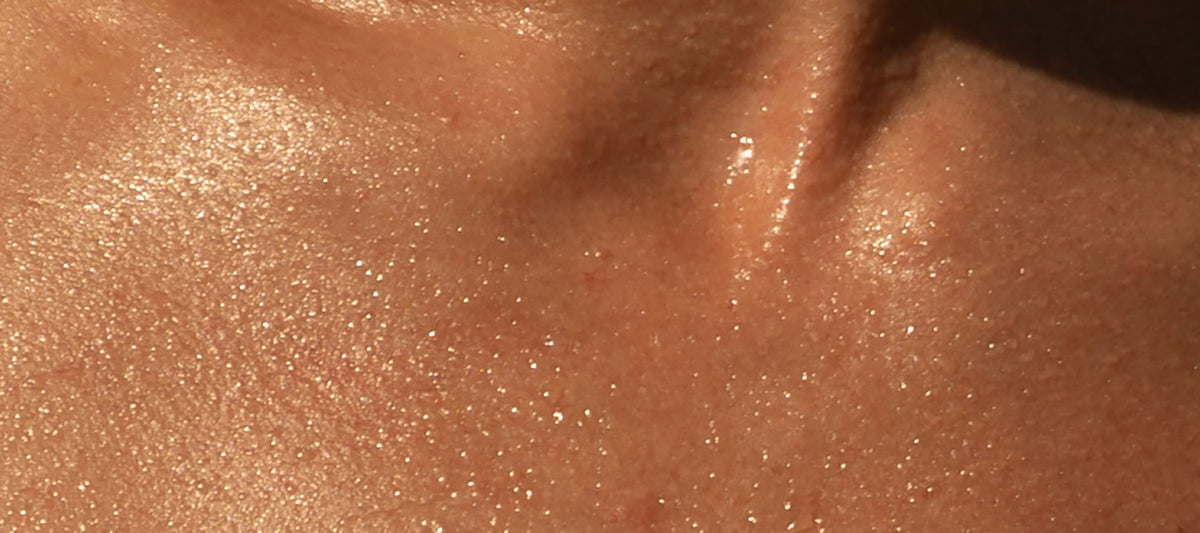 Close-up of glistening, sunlit skin showing natural texture and sheen.
