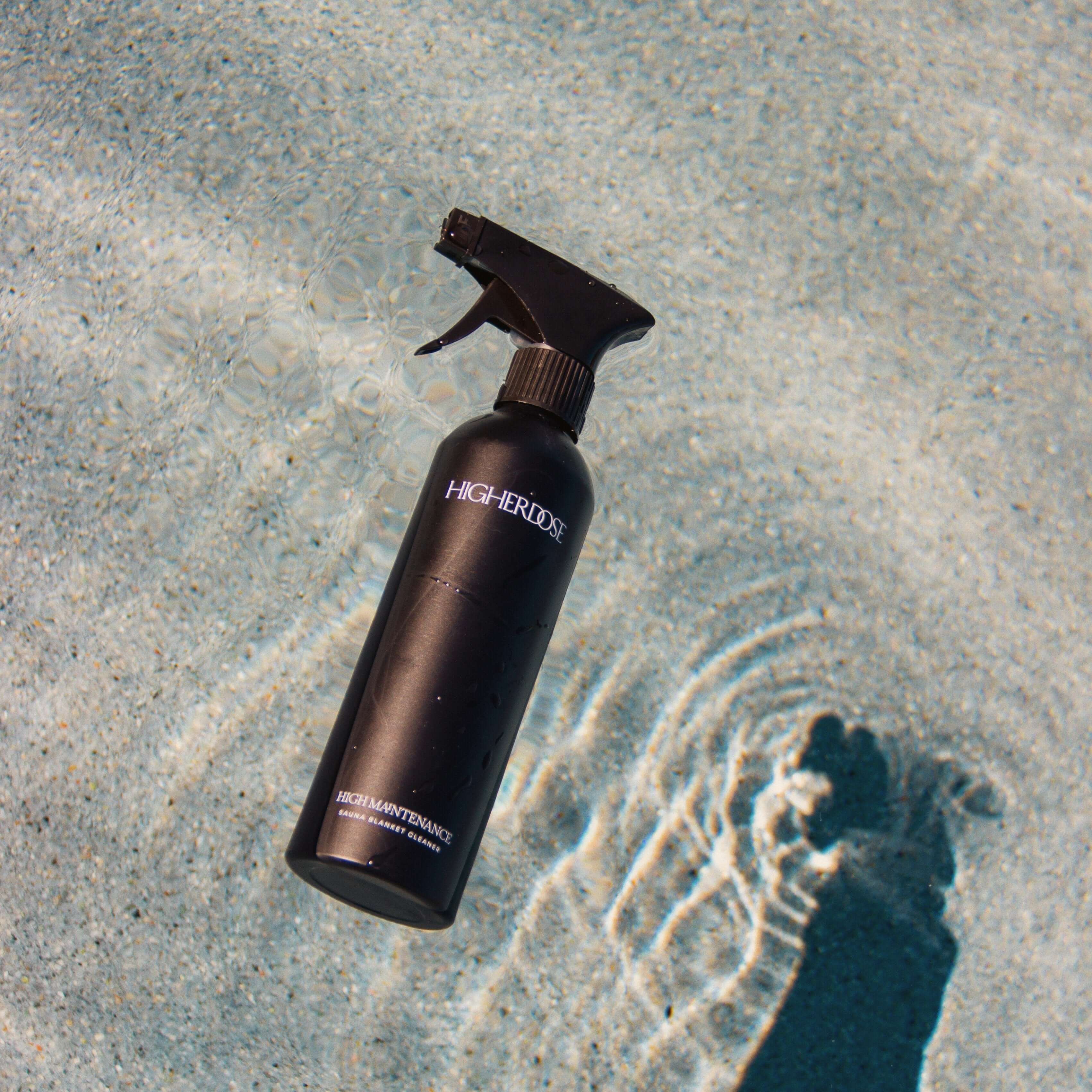 A black bottle of HigherDOSE High Maintenance Cleaner